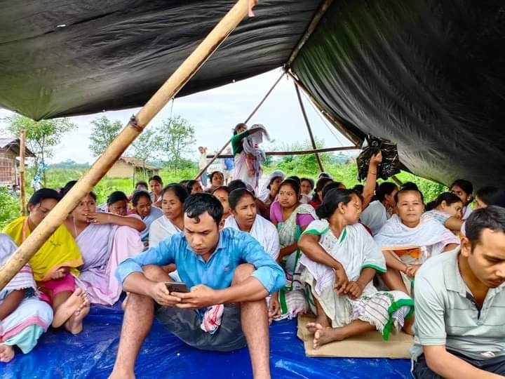 Villagers affected by the more than three-month-long raging fire and gas leakage from an oil well of the state-owned Oil India Limited field at Baghjan in eastern Assam launched a road blockade demanding compensation on September 17. (IANS Photo)